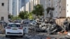 Israel - Burnt out vehicles in Ashkelon are pictured following a rocket attack from the Gaza Strip into Israel on October 7, 2023.