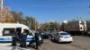 Kazakhstan -- A significant concentration of police near Central Park. Officers and police cars seen at the parking site. 25October2023