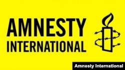 Amnesty International ұйымының логосы. Көрнекі сурет.