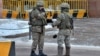 Kazakh law enforcement officers stand guard in Nur-Sultan