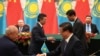 CHINA -- Kazakh President Nursultan Nazarbayev and Chinese President Xi Jinpin preside over a signing ceremony in the Great Hall of the People in Beijing, June 7, 2018