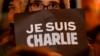 Плакат с надписью: "Je suis Charlie" ("Шарли - это я) - в руках участника акции в Ницце. 7 января 2015 года.